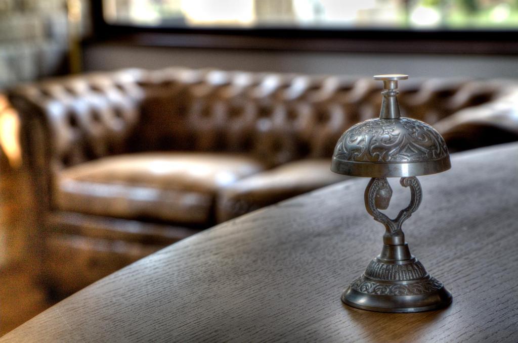 a small silver object sitting on a table at Hotel Cildá in Olleros de Pisuerga