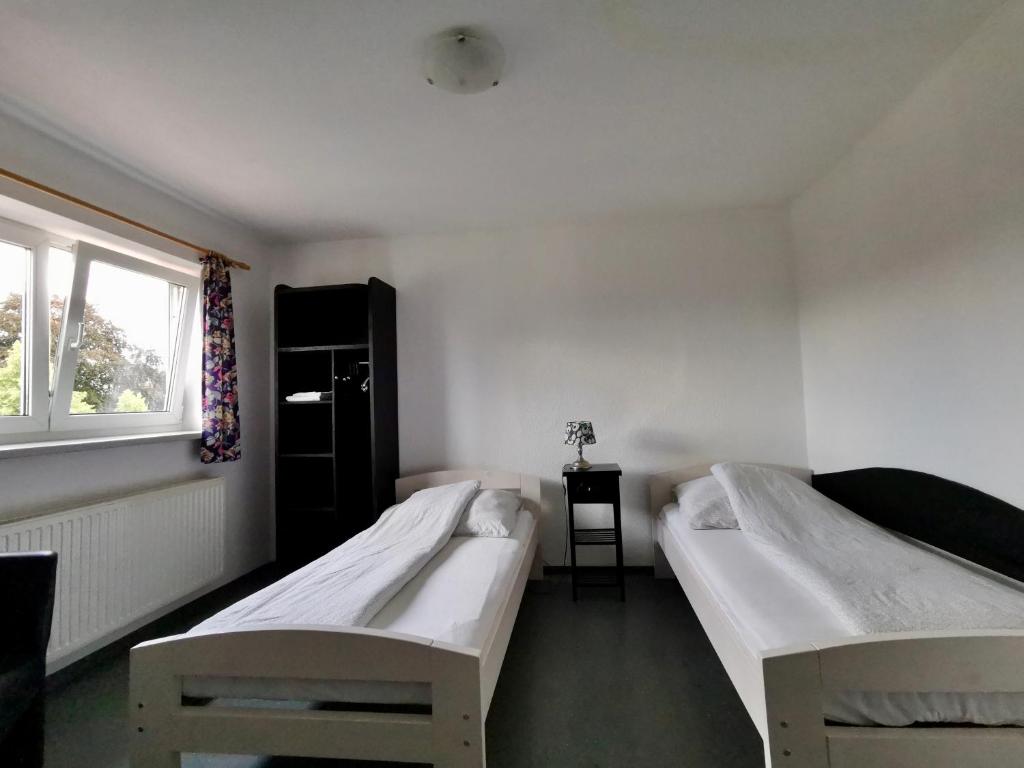 Ein Bett oder Betten in einem Zimmer der Unterkunft Pension Akropolis