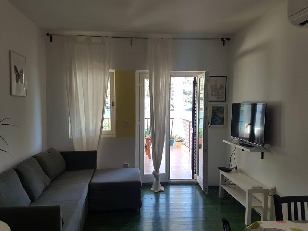 TV a/nebo společenská místnost v ubytování Grebaville Apartment