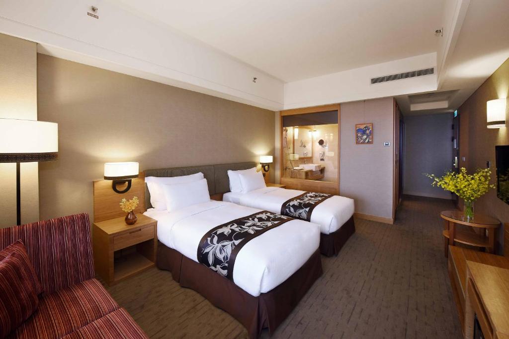 Postel nebo postele na pokoji v ubytování Fullon Hotel Hualien