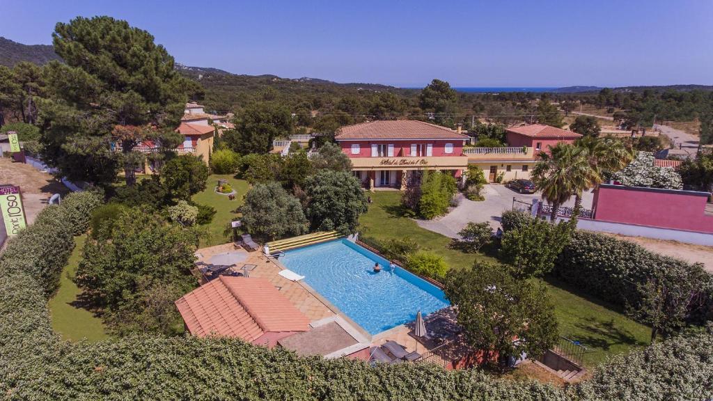 an aerial view of a house with a swimming pool at Hotel du Pont de l'Oso in Cala Rossa