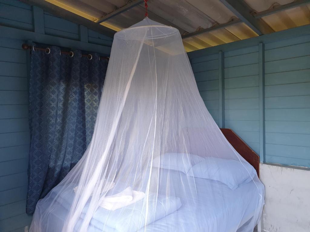 Postel nebo postele na pokoji v ubytování Baan Suan Coconut Ko Yao Noi