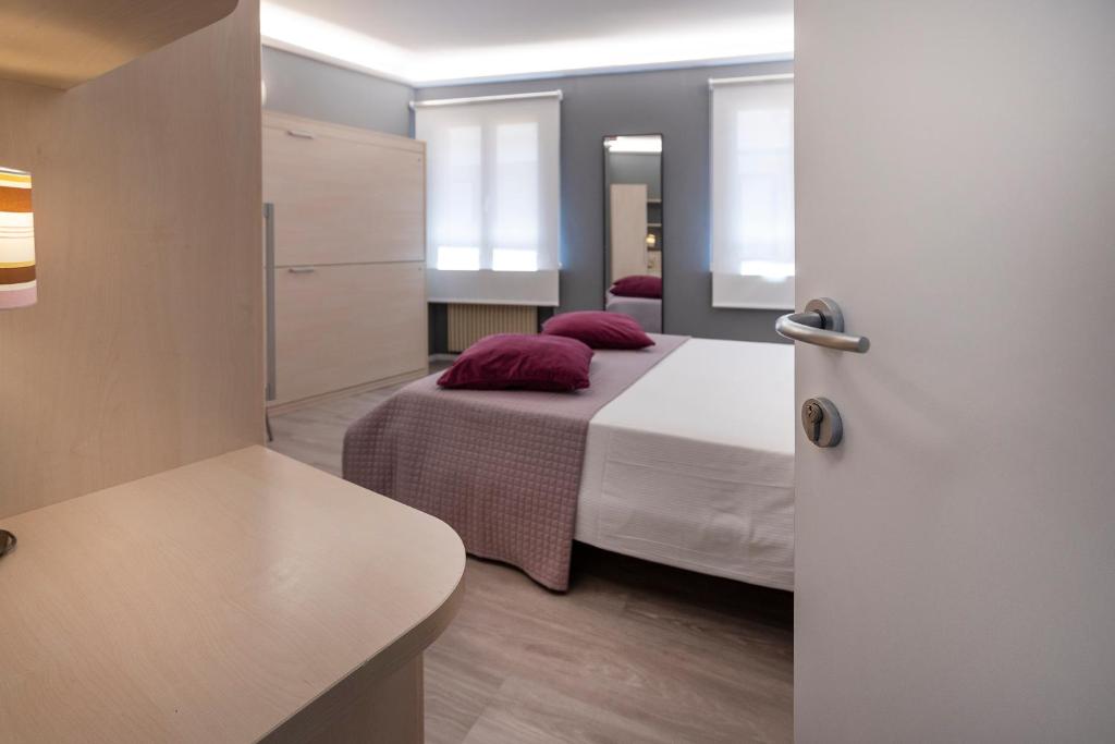 Postel nebo postele na pokoji v ubytování Albergo Aurora