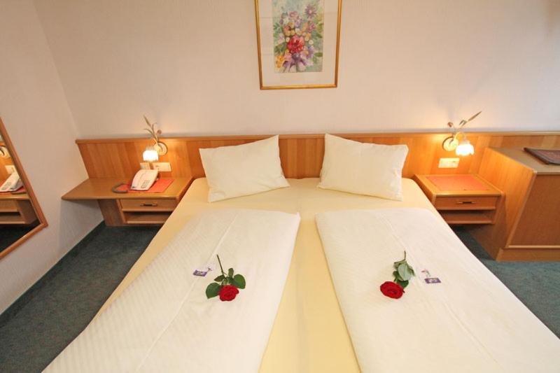 Postel nebo postele na pokoji v ubytování Hotel Mitterer