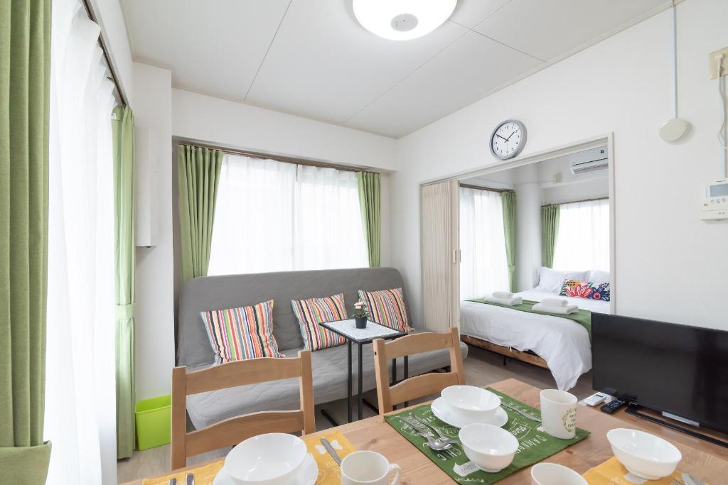Postel nebo postele na pokoji v ubytování Uhome Iriya Apartment