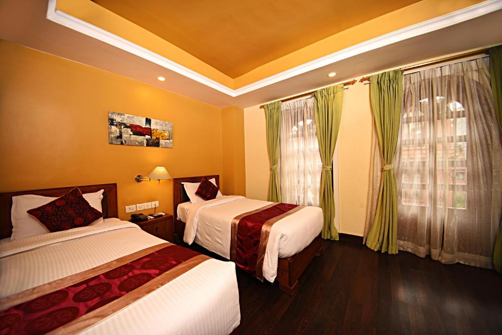 Postel nebo postele na pokoji v ubytování DOM Himalaya Hotel