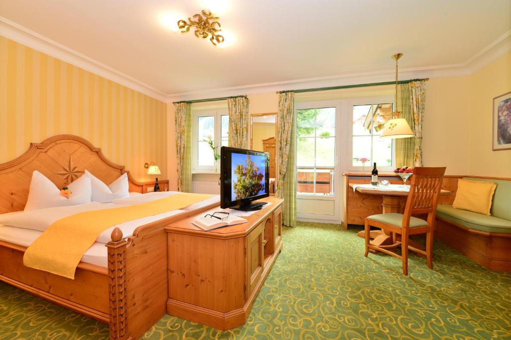 Postel nebo postele na pokoji v ubytování Hotel Garni Ingeborg