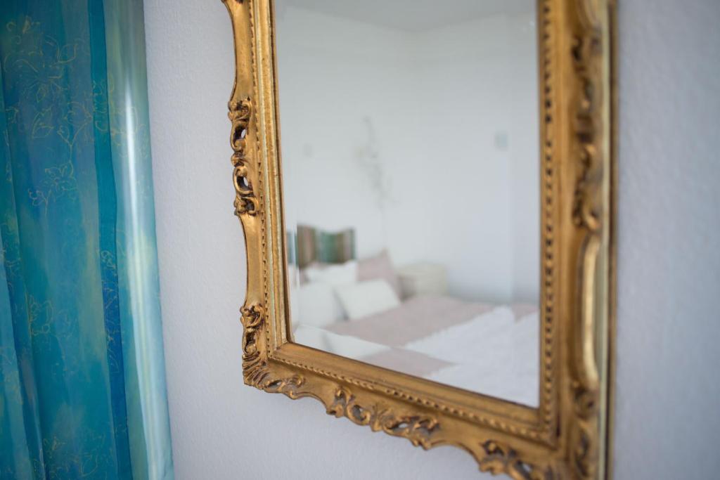 Postel nebo postele na pokoji v ubytování Hôtel de la Béroche