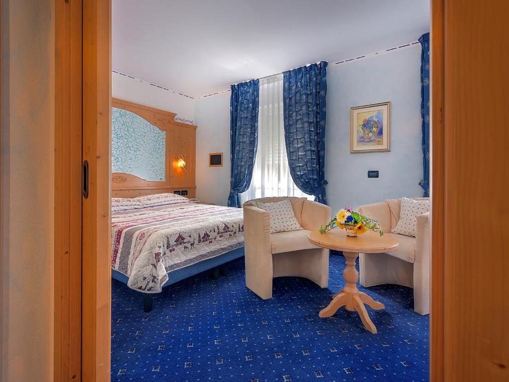 Ein Bett oder Betten in einem Zimmer der Unterkunft Al Posta Hotel 1899
