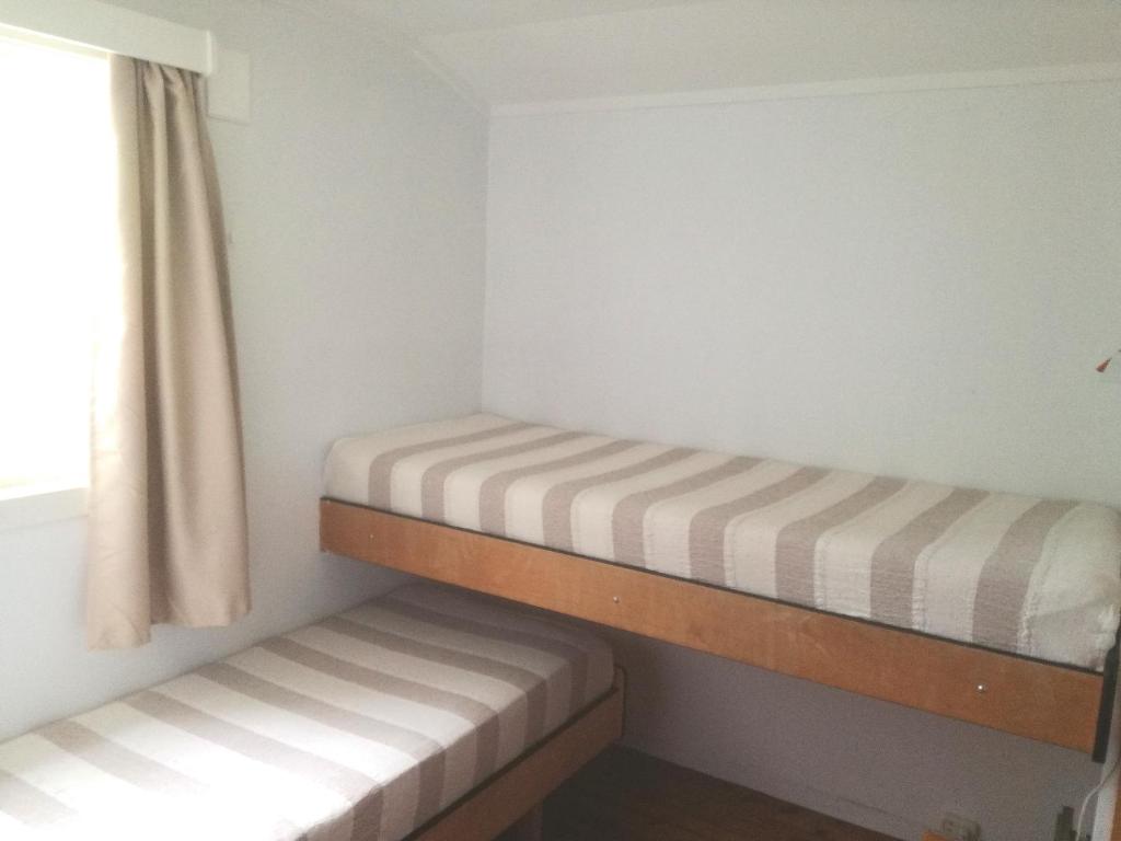Postel nebo postele na pokoji v ubytování Driva Hytter
