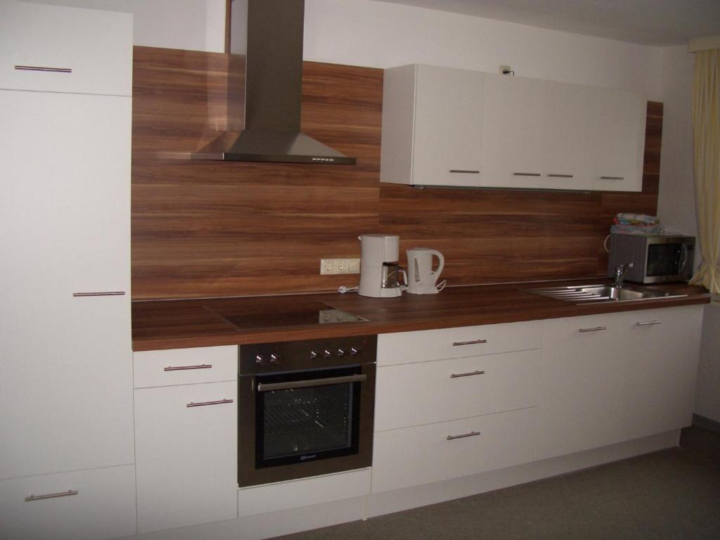 Kuchyň nebo kuchyňský kout v ubytování Ferienhaus Troy
