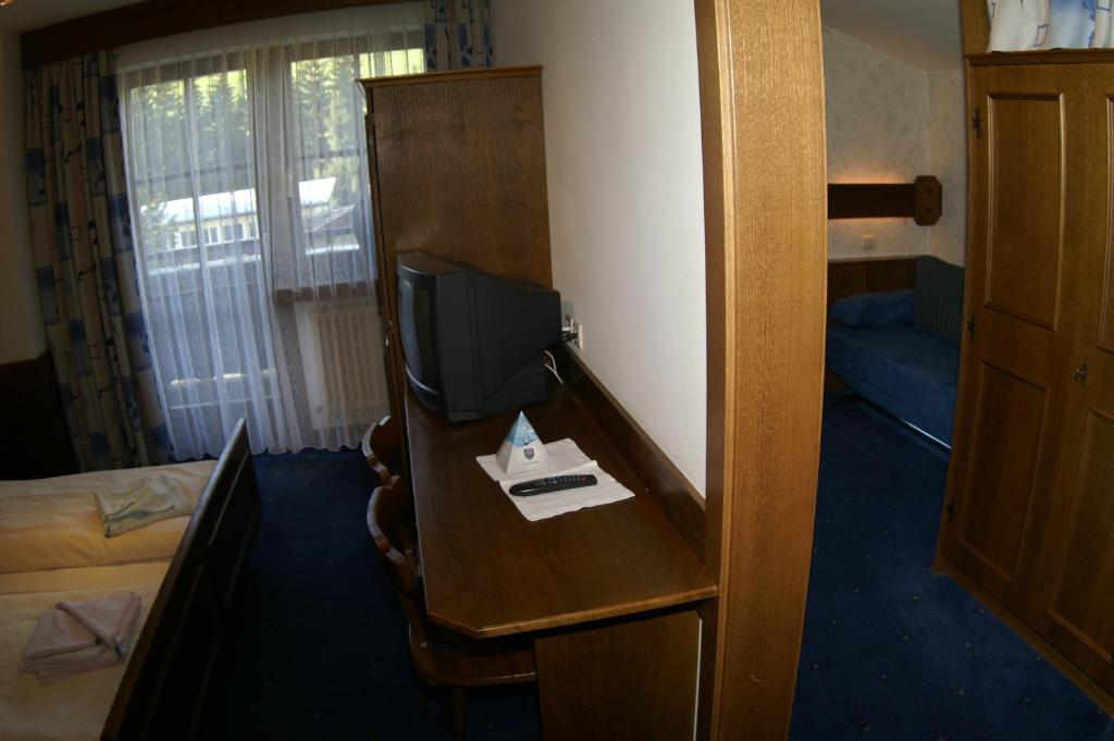 Postel nebo postele na pokoji v ubytování Pension Heidi