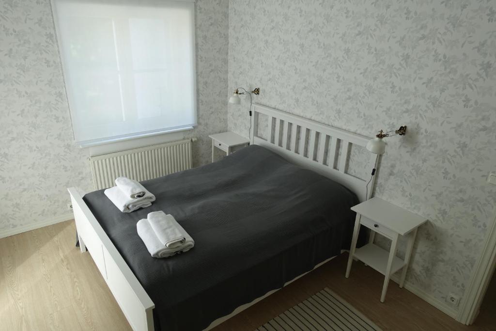 Postel nebo postele na pokoji v ubytování Kuressaare Park Apartment