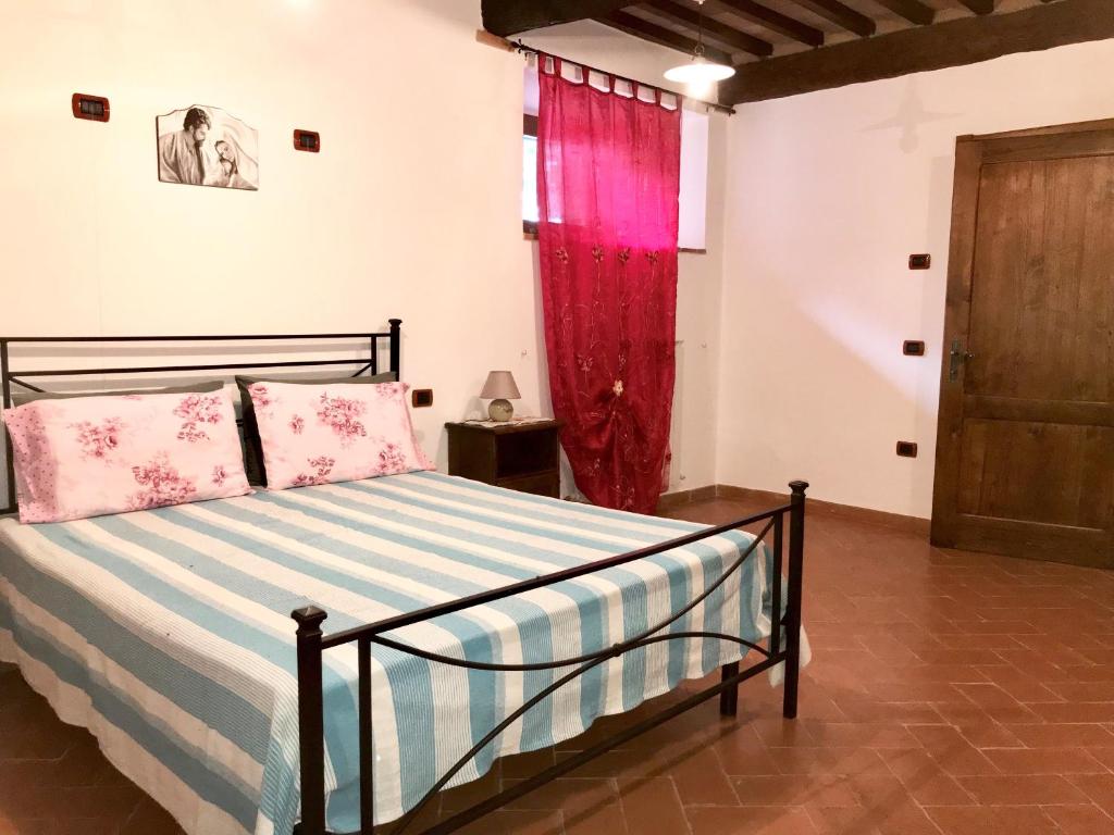 Postel nebo postele na pokoji v ubytování Agriturismo podere Casano