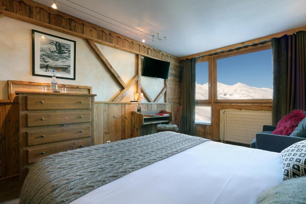 Un ou plusieurs lits dans un hébergement de l'établissement Hotel 3 Vallées Val Thorens