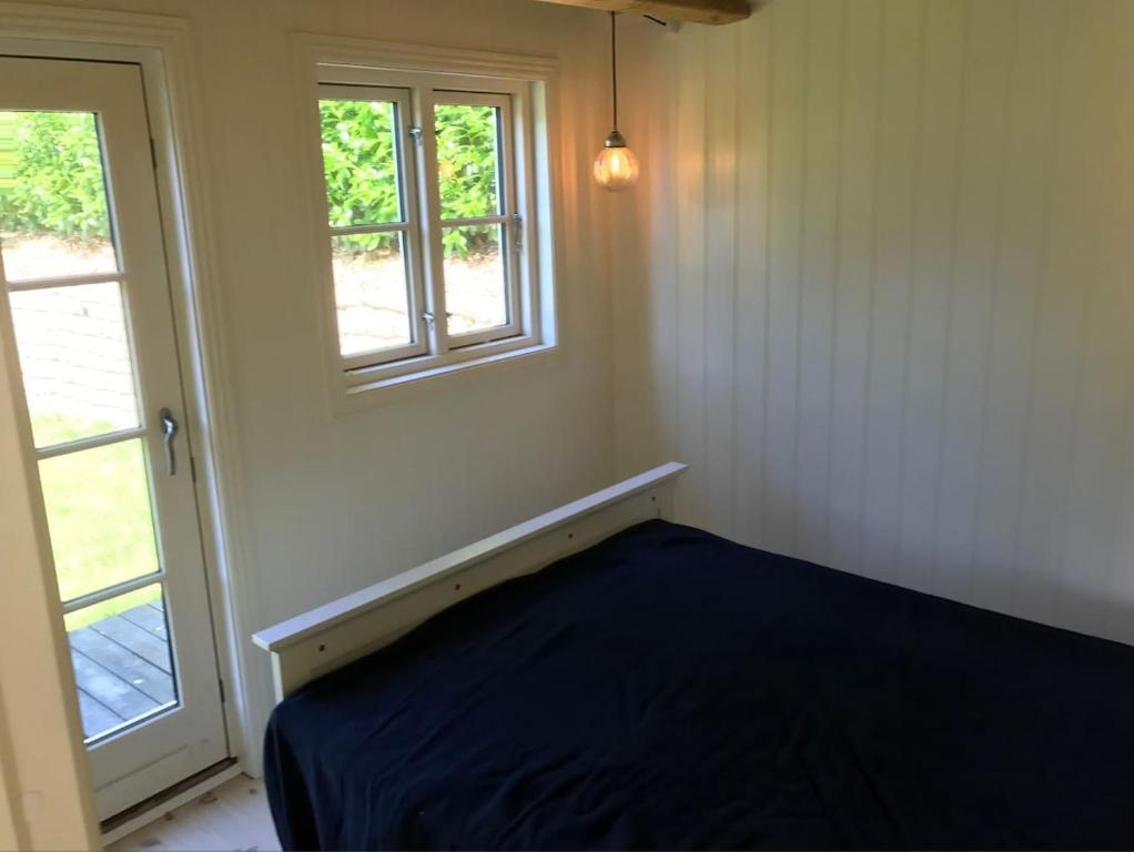 Säng eller sängar i ett rum på Sommerhus i idylliske omgivelser