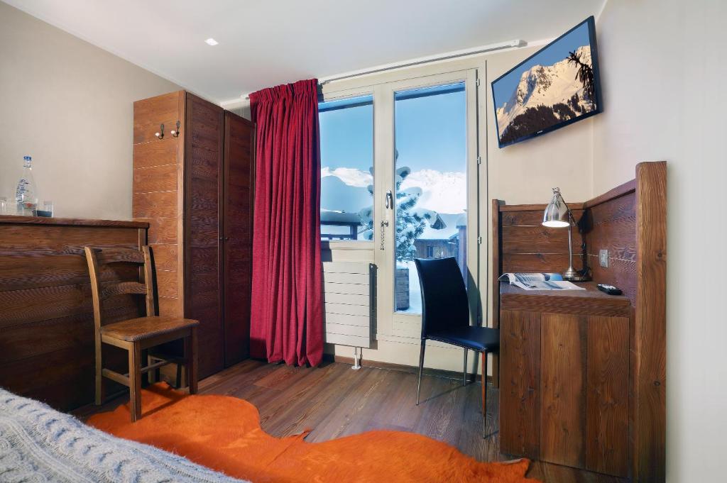 Un ou plusieurs lits dans un hébergement de l'établissement Hotel 3 Vallées Val Thorens