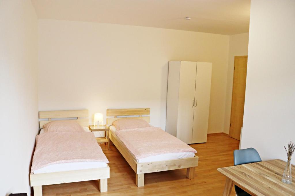 Ένα ή περισσότερα κρεβάτια σε δωμάτιο στο Fewo Burgunder