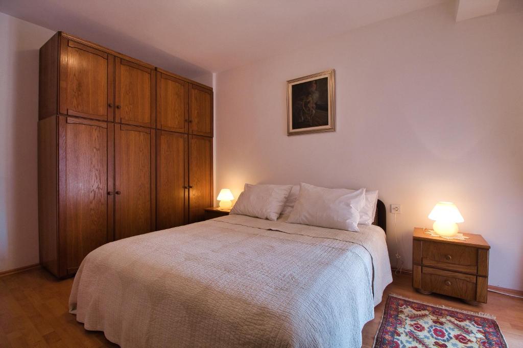 Postel nebo postele na pokoji v ubytování Apartments SI