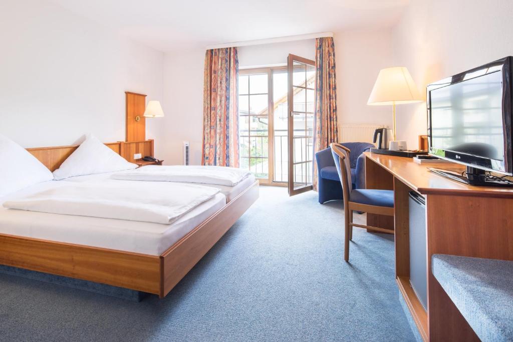 Postel nebo postele na pokoji v ubytování Hotel Blume