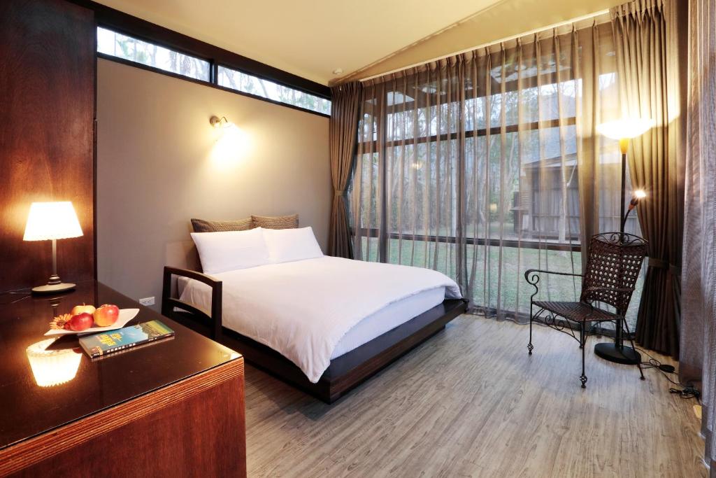 Voodi või voodid majutusasutuse 藏青谷 莊園Valley Statt Manor toas