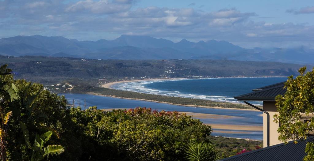 a view of a beach and the ocean at Mountain and Sea View Getaway in Plettenberg Bay
