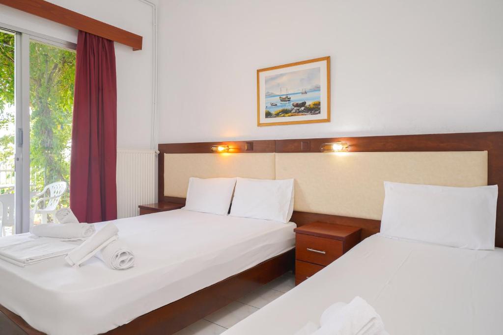 Postel nebo postele na pokoji v ubytování Chrissafis Hotel