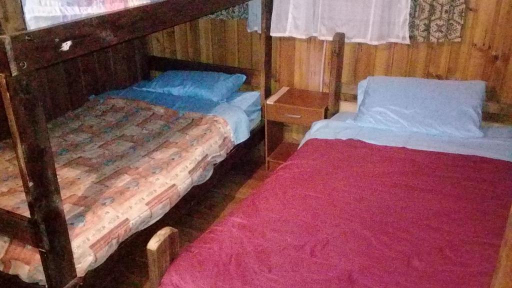 Postel nebo postele na pokoji v ubytování los troncos
