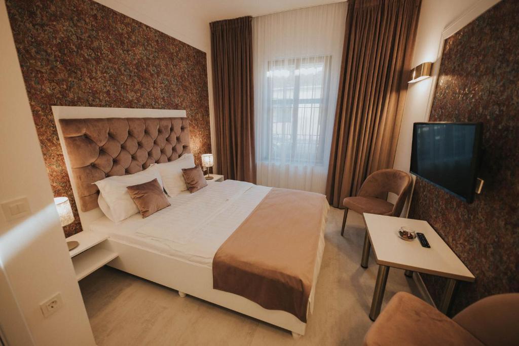 Un pat sau paturi într-o cameră la Hotel Marabella
