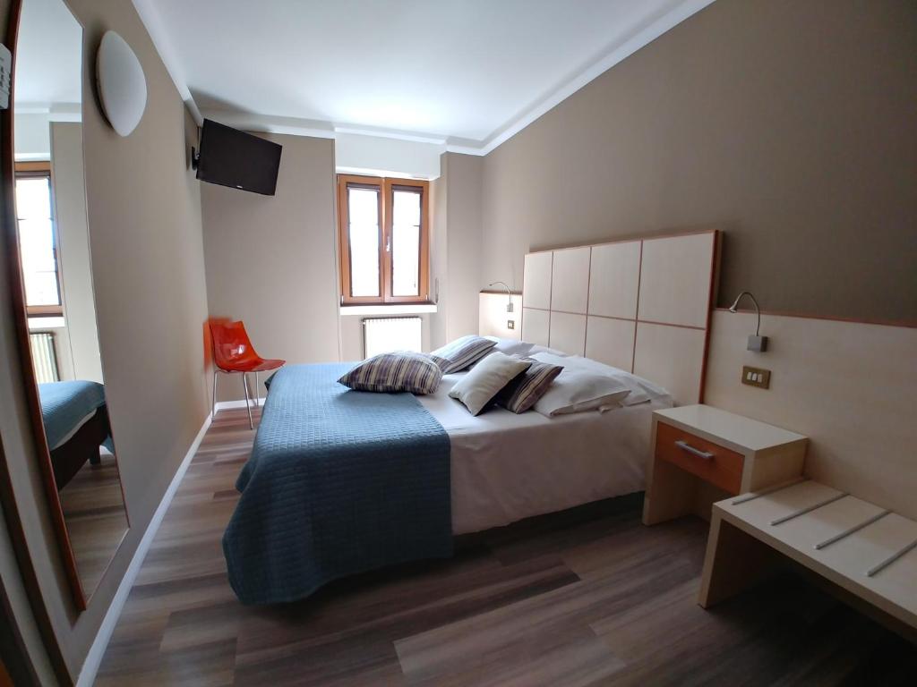 Postel nebo postele na pokoji v ubytování Albergo Aurora