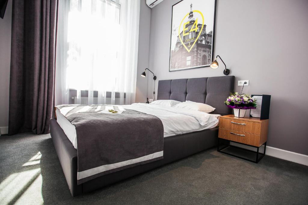 Postel nebo postele na pokoji v ubytování E4 Hotel