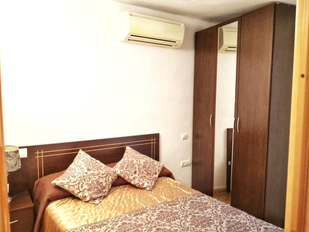 Cama o camas de una habitación en Apartamentos Cocó
