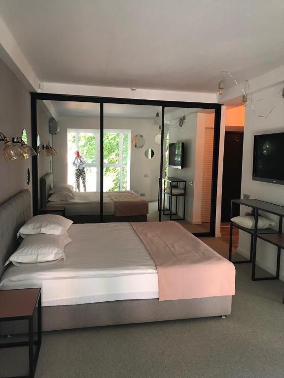 Postel nebo postele na pokoji v ubytování StanGret Hotel