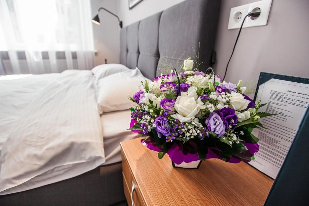 Postel nebo postele na pokoji v ubytování E4 Hotel