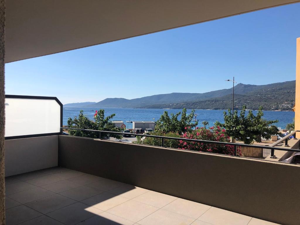 a balcony with a view of the water at Fronte di Mare in Propriano