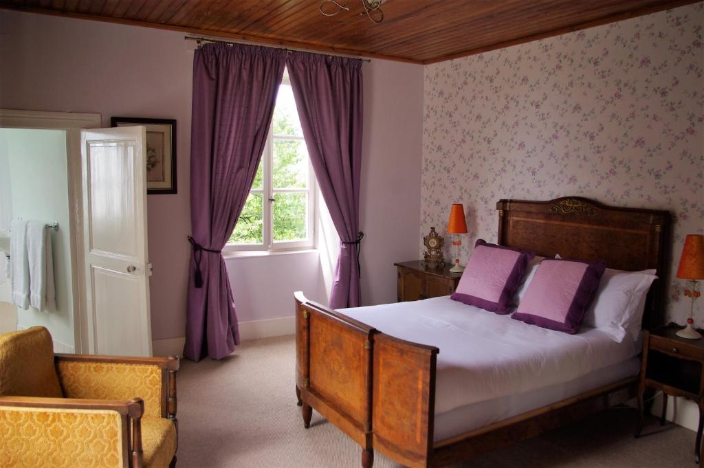 Säng eller sängar i ett rum på Chateau L'Orangerie