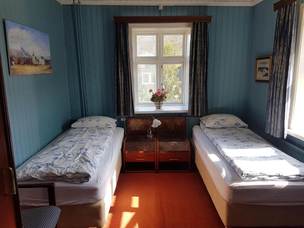 Postel nebo postele na pokoji v ubytování Guesthouse Gamli Bær