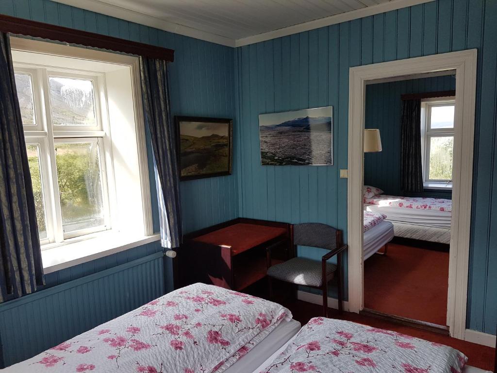 Postel nebo postele na pokoji v ubytování Guesthouse Gamli Bær
