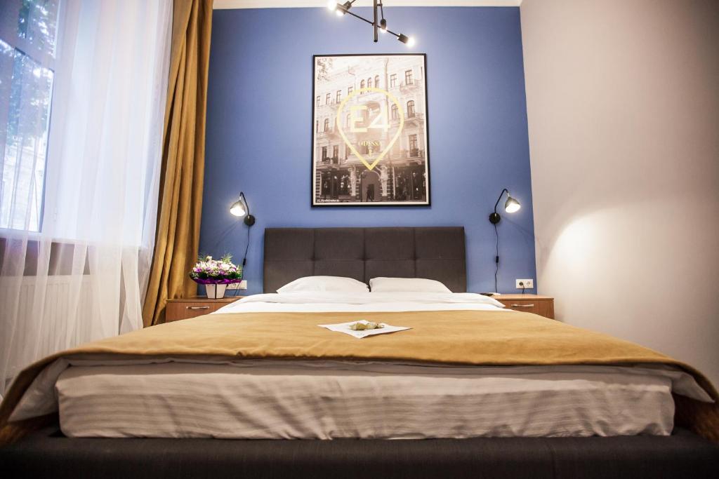 Postel nebo postele na pokoji v ubytování E4 Hotel