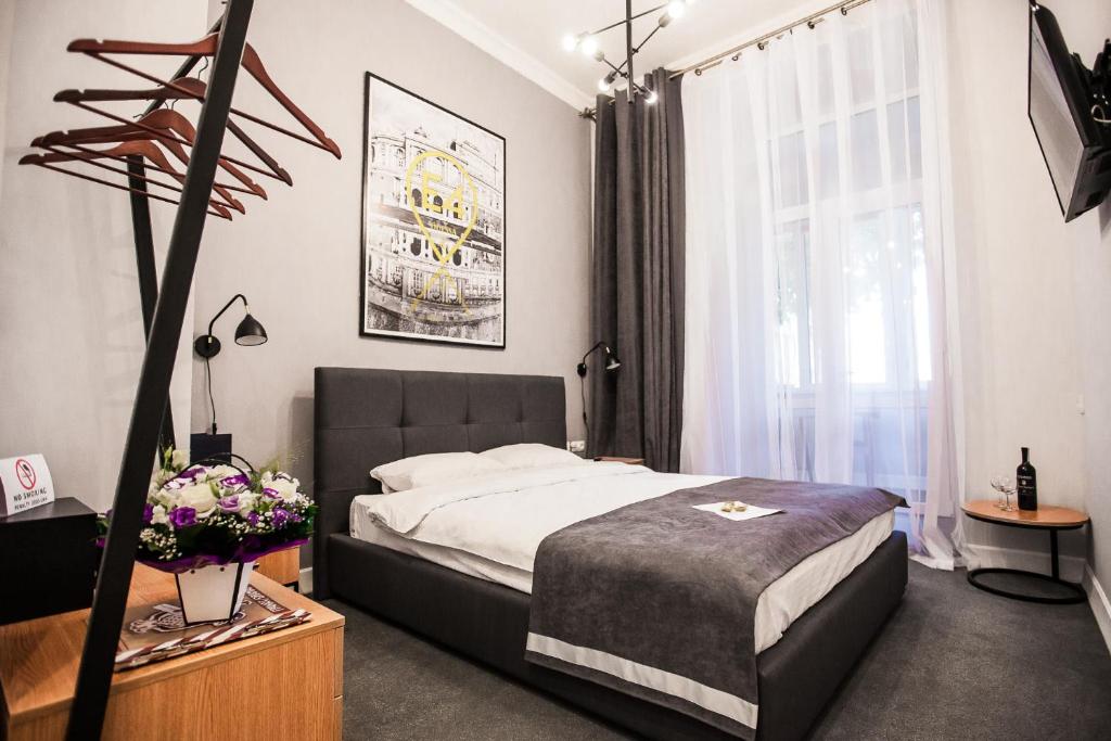 Postel nebo postele na pokoji v ubytování E4 Hotel