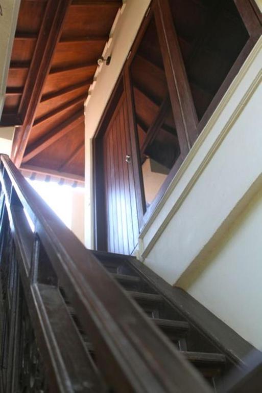 an escalator leading up to a building with a window at Martas Hotel in Gili Trawangan
