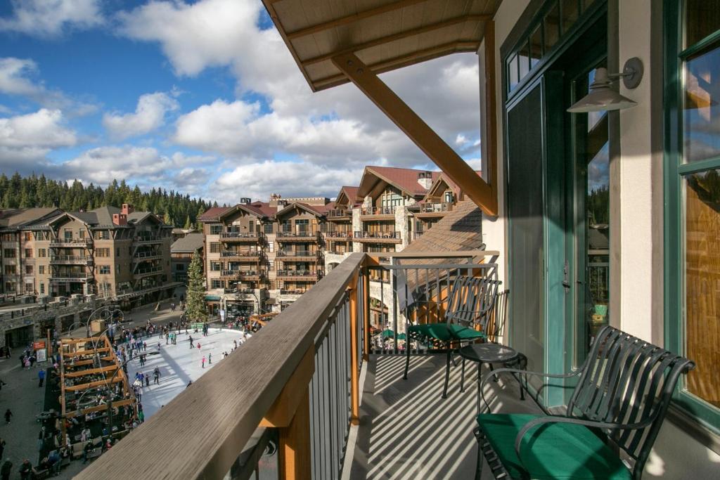 a balcony with chairs and a view of a resort at Stunning Top Floor Village at Northstar Residence! - Big Horn 502 in Truckee