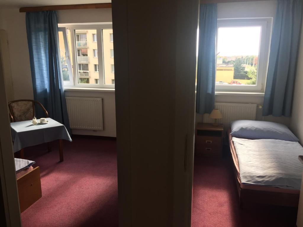 Postel nebo postele na pokoji v ubytování Hotel-Pension KAMÝK