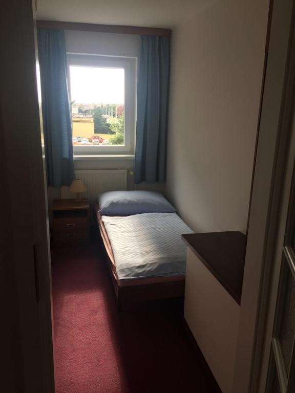 Postel nebo postele na pokoji v ubytování Hotel-Pension KAMÝK
