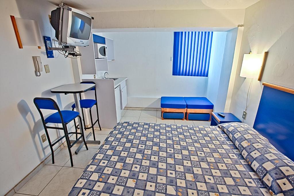 Postel nebo postele na pokoji v ubytování Hotel H Americas