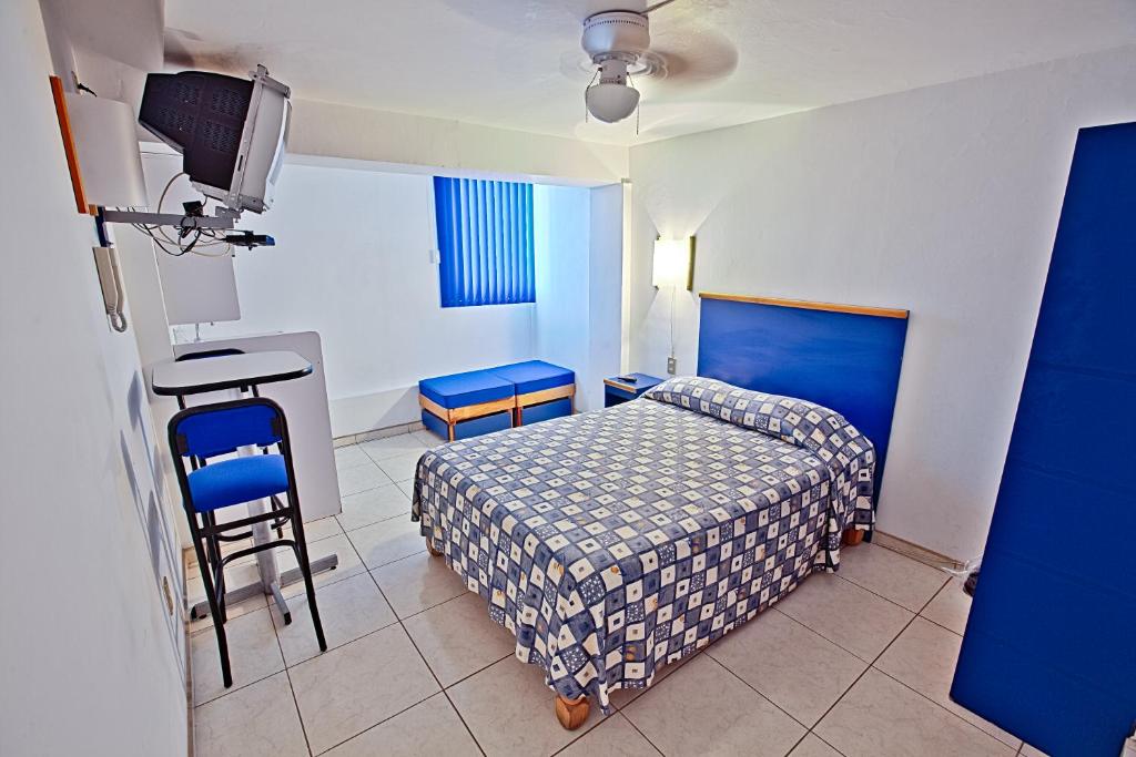 Postel nebo postele na pokoji v ubytování Hotel H Americas