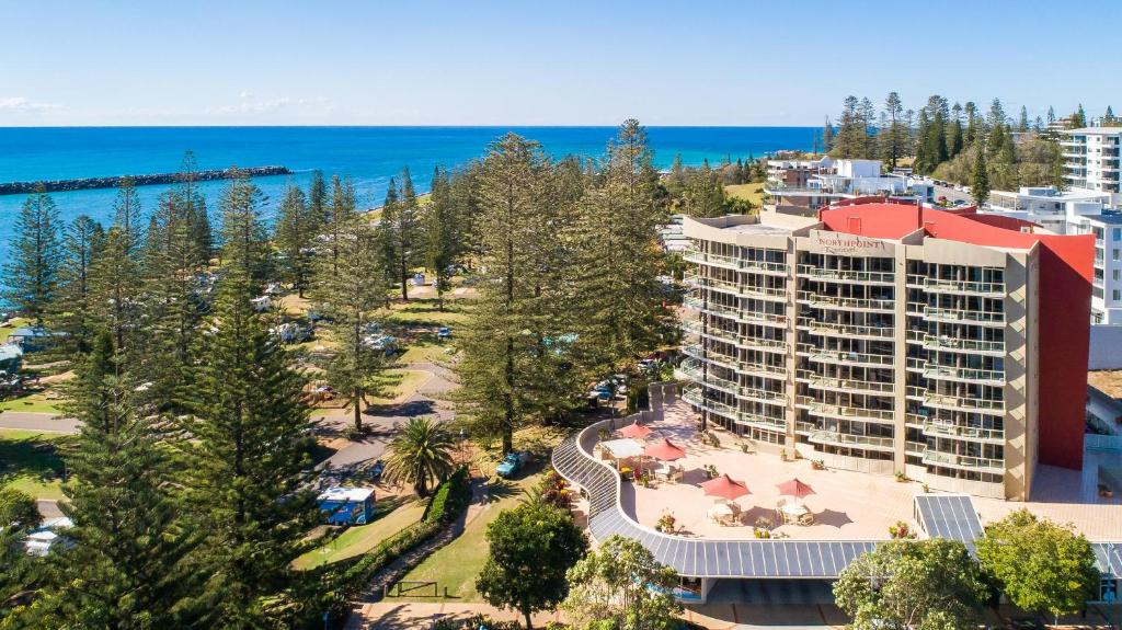 an aerial view of a resort and the ocean at Northpoint Apartments in Port Macquarie