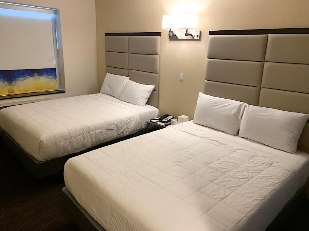 Postel nebo postele na pokoji v ubytování 7 Days Hotel
