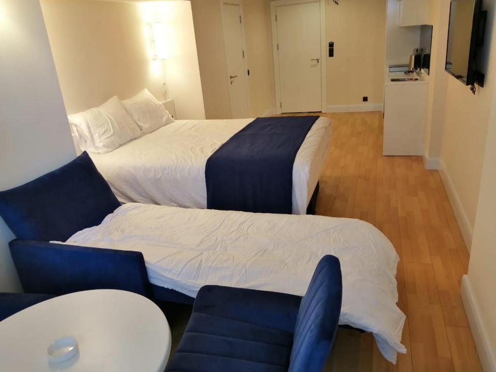 Postel nebo postele na pokoji v ubytování Lamar hotel