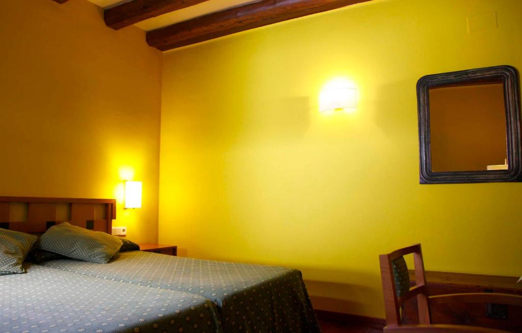 Postel nebo postele na pokoji v ubytování Hotel Vall Ferrera